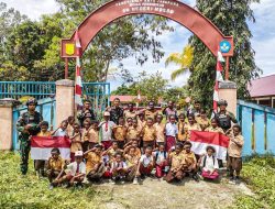 Di Peringatan Hari Pramuka Satgas Yonif 122/TS Menanam Tunas Kelapa Bersama Siswa-siswi Di SDN Mosso Papua